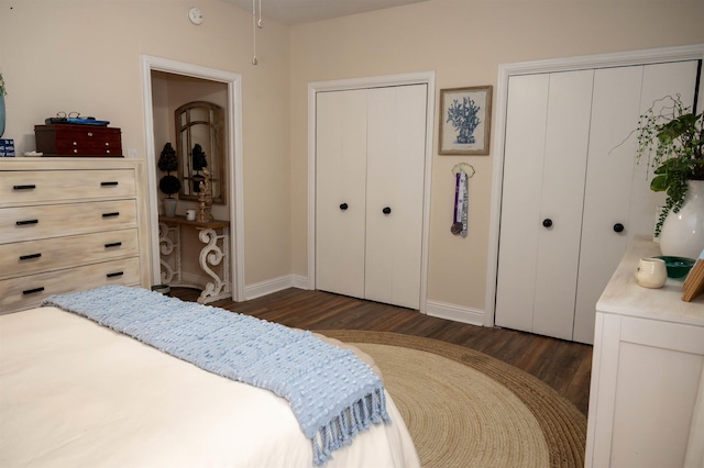475 N Highland St Unit 3H, Memphis, TN 38122 - bedroom featuring dark wood finished floors and two closets
