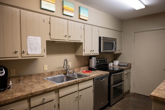 475 N Highland St Unit 3H, Memphis, TN 38122 - kitchen with appliances with stainless steel finishes, white cabinetry, and light countertops