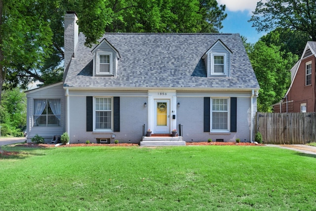 1856 N Rainbow Dr, Memphis, TN 38107 - cape cod-style house with a chimney, brick siding, and a shingled roof