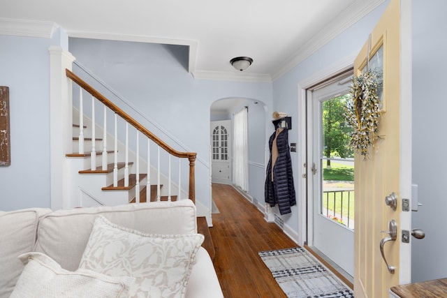 1856 N Rainbow Dr, Memphis, TN 38107 - entrance foyer featuring arched walkways, dark wood finished floors, crown molding, and stairway