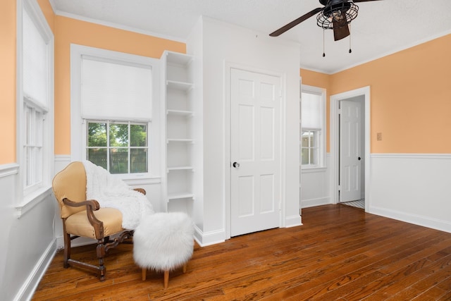 1856 N Rainbow Dr, Memphis, TN 38107 - sitting room with a ceiling fan, hardwood / wood-style floors, ornamental molding, and a wainscoted wall