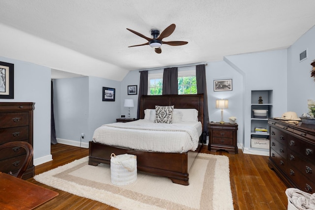 1856 N Rainbow Dr, Memphis, TN 38107 - bedroom with wood finished floors, vaulted ceiling, a ceiling fan, and a textured ceiling