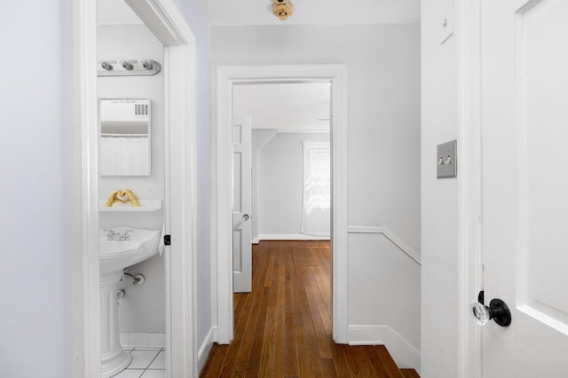1856 N Rainbow Dr, Memphis, TN 38107 - hallway with dark wood finished floors and baseboards