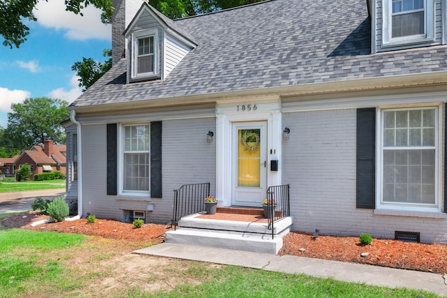 1856 N Rainbow Dr, Memphis, TN 38107 - view of front facade with brick siding, roof with shingles, and a chimney