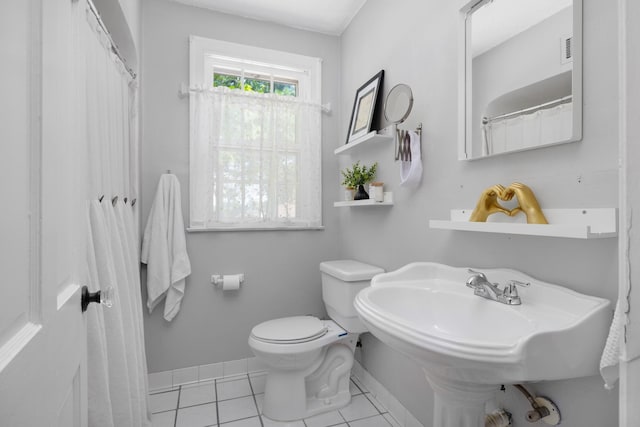 1856 N Rainbow Dr, Memphis, TN 38107 - bathroom featuring toilet and tile patterned flooring