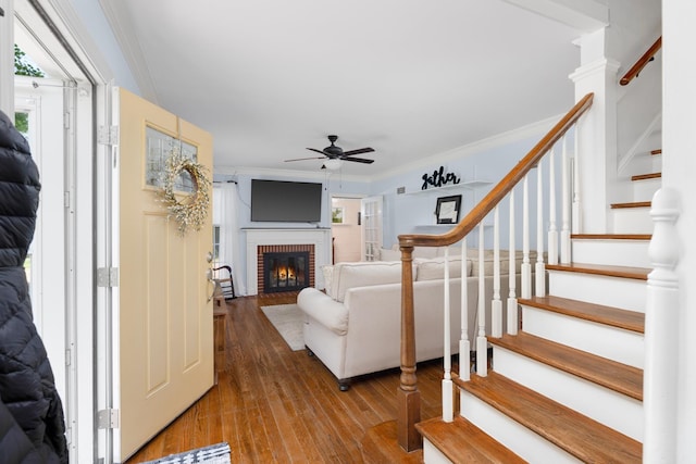 1856 N Rainbow Dr, Memphis, TN 38107 - living room with ceiling fan, stairs, hardwood / wood-style flooring, plenty of natural light, and crown molding