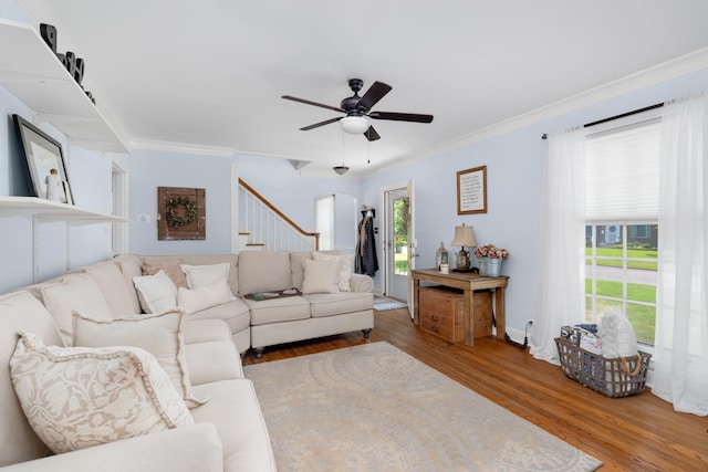 1856 N Rainbow Dr, Memphis, TN 38107 - living room featuring wood finished floors, crown molding, stairway, and a ceiling fan