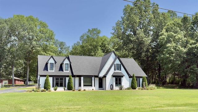 12380 Fox Lair Dr, Collierville, TN 38017 - view of front of house featuring a front yard, a shingled roof, and view of wooded area