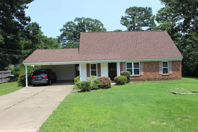 3642 Charlene Rd, Bartlett, TN 38135 - view of front facade with concrete driveway, a front yard, a carport, roof with shingles, and brick siding