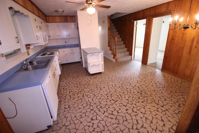 3642 Charlene Rd, Bartlett, TN 38135 - kitchen with wood walls, white cabinetry, ceiling fan, white appliances, and open shelves