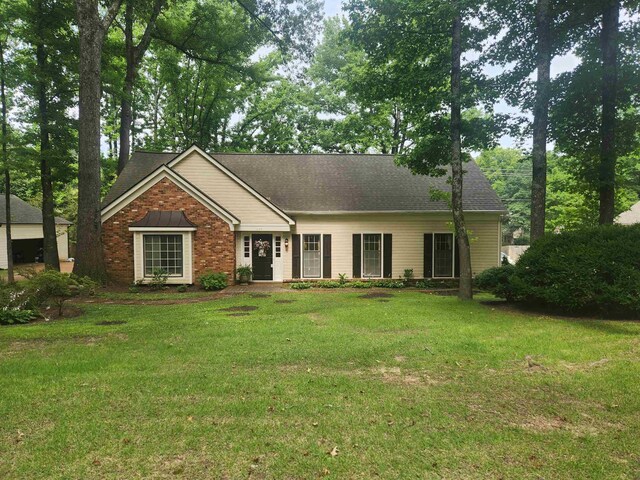 2155 Wickersham Ln, Germantown, TN 38139 - ranch-style home with a front yard, a shingled roof, and brick siding