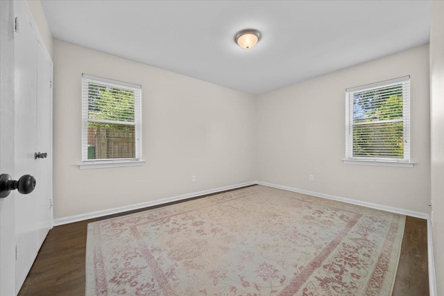 1469 Poplar Estates Pkwy, Germantown, TN 38138 - unfurnished room featuring healthy amount of natural light and dark wood-style flooring