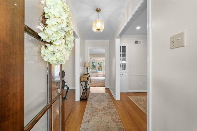 1469 Poplar Estates Pkwy, Germantown, TN 38138 - entrance foyer with wood finished floors and crown molding