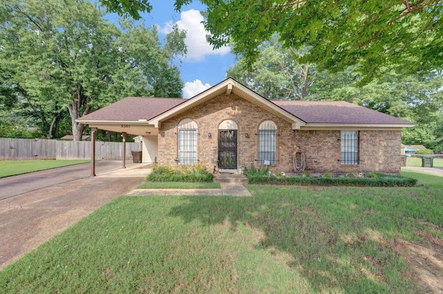 6385 Easthampton Cv, Bartlett, TN 38134 - view of front of house featuring brick siding, an attached carport, concrete driveway, and roof with shingles