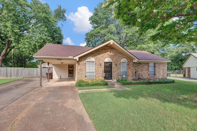 6385 Easthampton Cv, Bartlett, TN 38134 - view of front of property with concrete driveway, brick siding, an attached carport, and a shingled roof