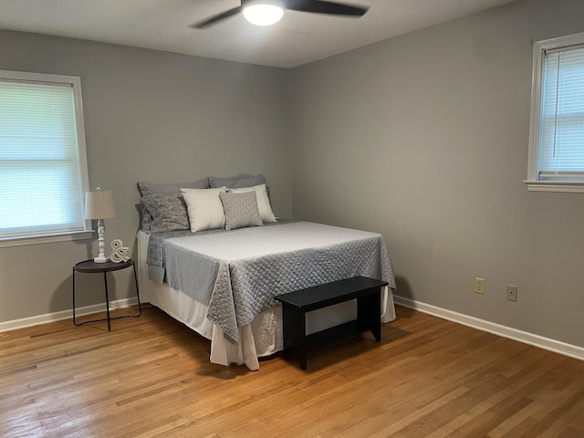 7241 Renda St, Millington, TN 38053 - bedroom with light wood-style flooring, multiple windows, and a ceiling fan