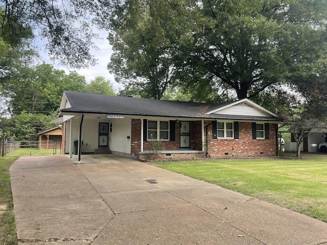 7241 Renda St, Millington, TN 38053 - ranch-style home featuring crawl space, brick siding, concrete driveway, and a carport