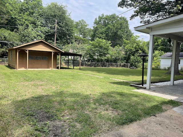 7241 Renda St, Millington, TN 38053 - view of yard featuring a detached garage and an outbuilding