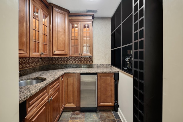 236 Riveredge Cv, Memphis, TN 38018 - bar with dark stone finish flooring and refrigerator