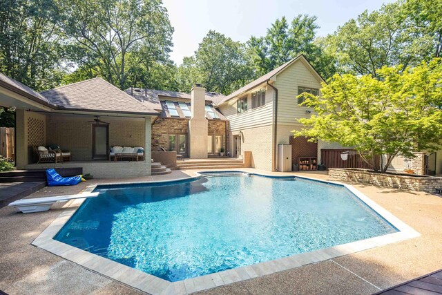 236 Riveredge Cv, Memphis, TN 38018 - view of swimming pool featuring outdoor lounge area, a patio, and a diving board