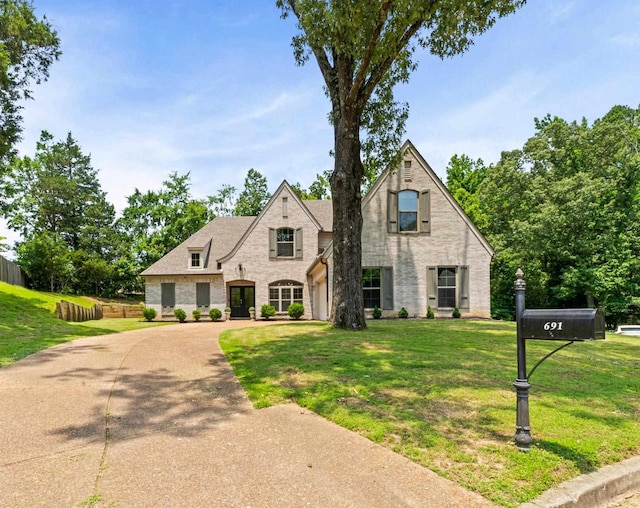 691 Rocky Field Cv, Memphis, TN 38018 - view of front of house with brick siding, driveway, and a garage