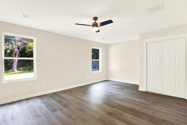 3374 Given Ave, Memphis, TN 38122 - unfurnished bedroom with dark wood-style flooring, ceiling fan, and a closet