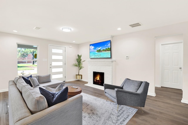 3374 Given Ave, Memphis, TN 38122 - living room featuring wood finished floors, a fireplace, and recessed lighting