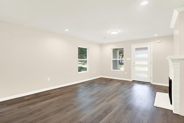 3374 Given Ave, Memphis, TN 38122 - unfurnished living room with dark wood-style floors, recessed lighting, and a fireplace