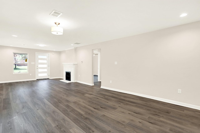 3374 Given Ave, Memphis, TN 38122 - unfurnished living room with dark wood finished floors, a fireplace, and recessed lighting