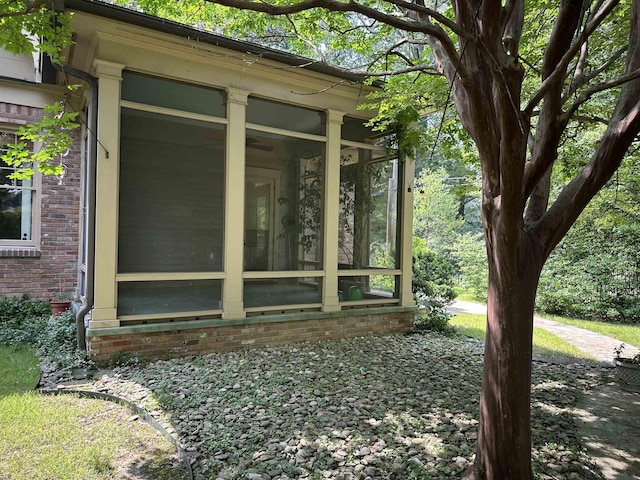 4042 Goodlett Cv, Memphis, TN 38111 - view of side of property with a sunroom and brick siding