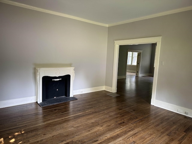 4042 Goodlett Cv, Memphis, TN 38111 - unfurnished living room featuring dark wood-style floors, ornamental molding, and a fireplace with raised hearth