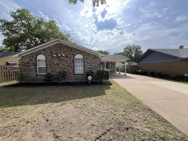 4786 Chevron Rd, Memphis, TN 38118 - single story home with concrete driveway, brick siding, and an attached carport