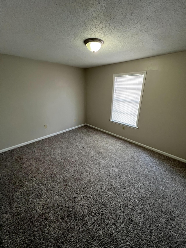 4786 Chevron Rd, Memphis, TN 38118 - carpeted spare room with a textured ceiling and baseboards