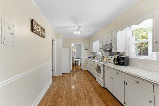 4670 Kaye Rd, Memphis, TN 38117 - kitchen with white appliances, under cabinet range hood, backsplash, ornamental molding, and a ceiling fan