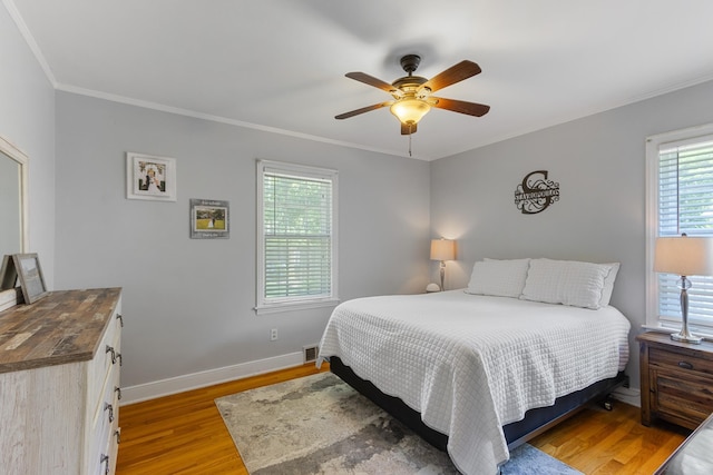 4670 Kaye Rd, Memphis, TN 38117 - bedroom with light wood-style floors, crown molding, and a ceiling fan
