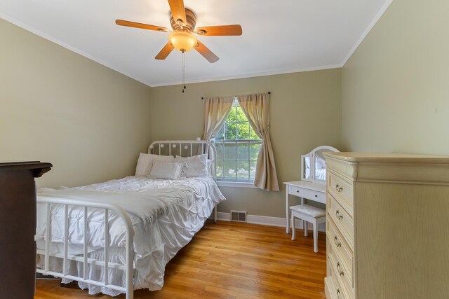 4670 Kaye Rd, Memphis, TN 38117 - bedroom with crown molding, light wood-style flooring, and a ceiling fan