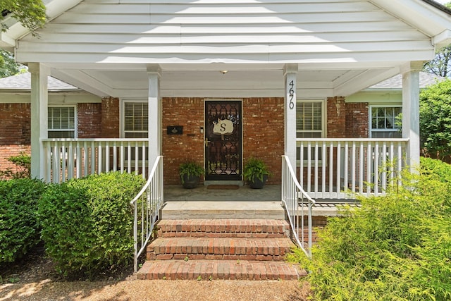 4670 Kaye Rd, Memphis, TN 38117 - property entrance featuring brick siding and a porch