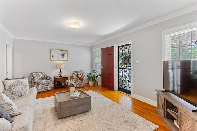 4670 Kaye Rd, Memphis, TN 38117 - living area featuring crown molding, healthy amount of natural light, and wood finished floors