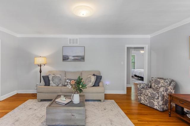 4670 Kaye Rd, Memphis, TN 38117 - living area with ornamental molding and wood finished floors