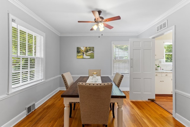4670 Kaye Rd, Memphis, TN 38117 - dining area with light wood-type flooring, ceiling fan, and ornamental molding