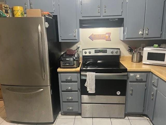 3115 S Wesley Ct, Memphis, TN 38119 - kitchen featuring stainless steel appliances, under cabinet range hood, gray cabinets, light tile patterned floors, and light countertops
