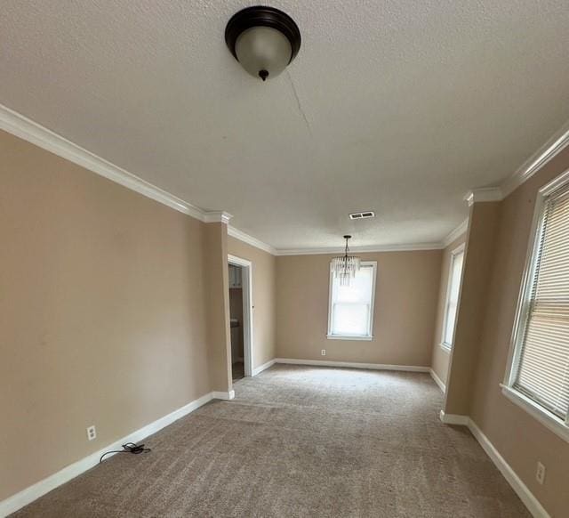 1274 Railton Rd, Memphis, TN 38111 - spare room featuring a chandelier, carpet, crown molding, and a textured ceiling