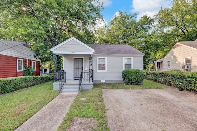 2154 N Hubert Cir, Memphis, TN 38108 - view of front of property featuring a front yard, covered porch, roof with shingles, and crawl space