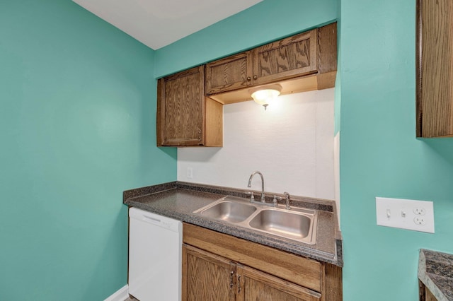 2154 N Hubert Cir, Memphis, TN 38108 - kitchen featuring white dishwasher and dark countertops