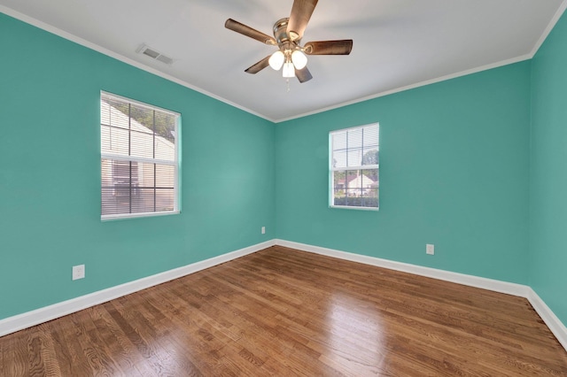2154 N Hubert Cir, Memphis, TN 38108 - empty room with ceiling fan, wood finished floors, and crown molding