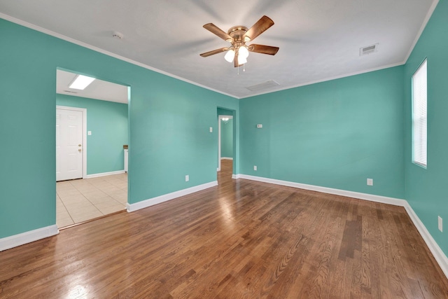2154 N Hubert Cir, Memphis, TN 38108 - spare room featuring a ceiling fan, ornamental molding, wood finished floors, and a smoke detector