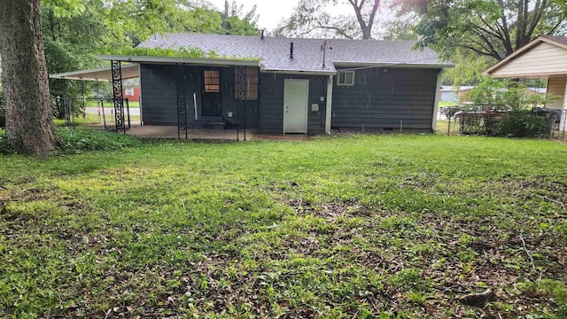 4592 Neely Rd, Memphis, TN 38109 - back of property with a patio area and a shingled roof
