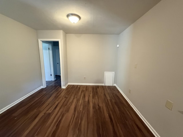 4592 Neely Rd, Memphis, TN 38109 - spare room with baseboards and dark wood-style flooring