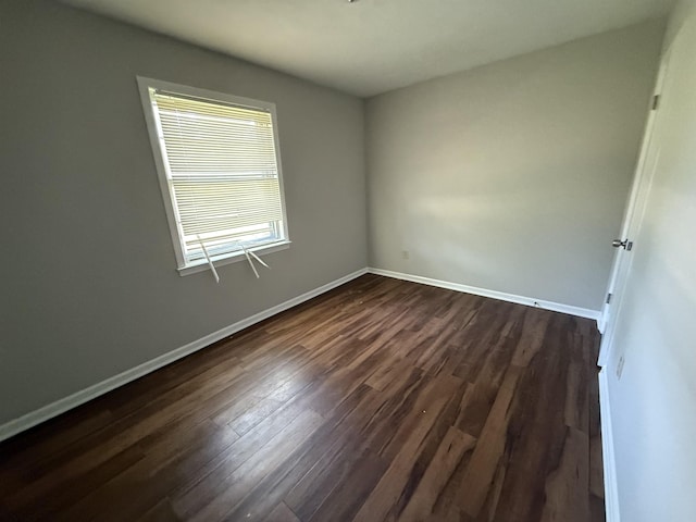 4592 Neely Rd, Memphis, TN 38109 - empty room featuring dark wood-style floors and baseboards