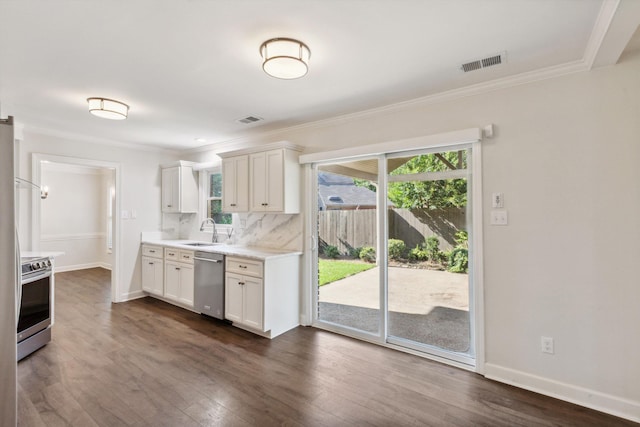 8394 N Westfair Cir N, Germantown, TN 38139 - kitchen featuring stainless steel appliances, light countertops, crown molding, dark wood-style floors, and white cabinetry